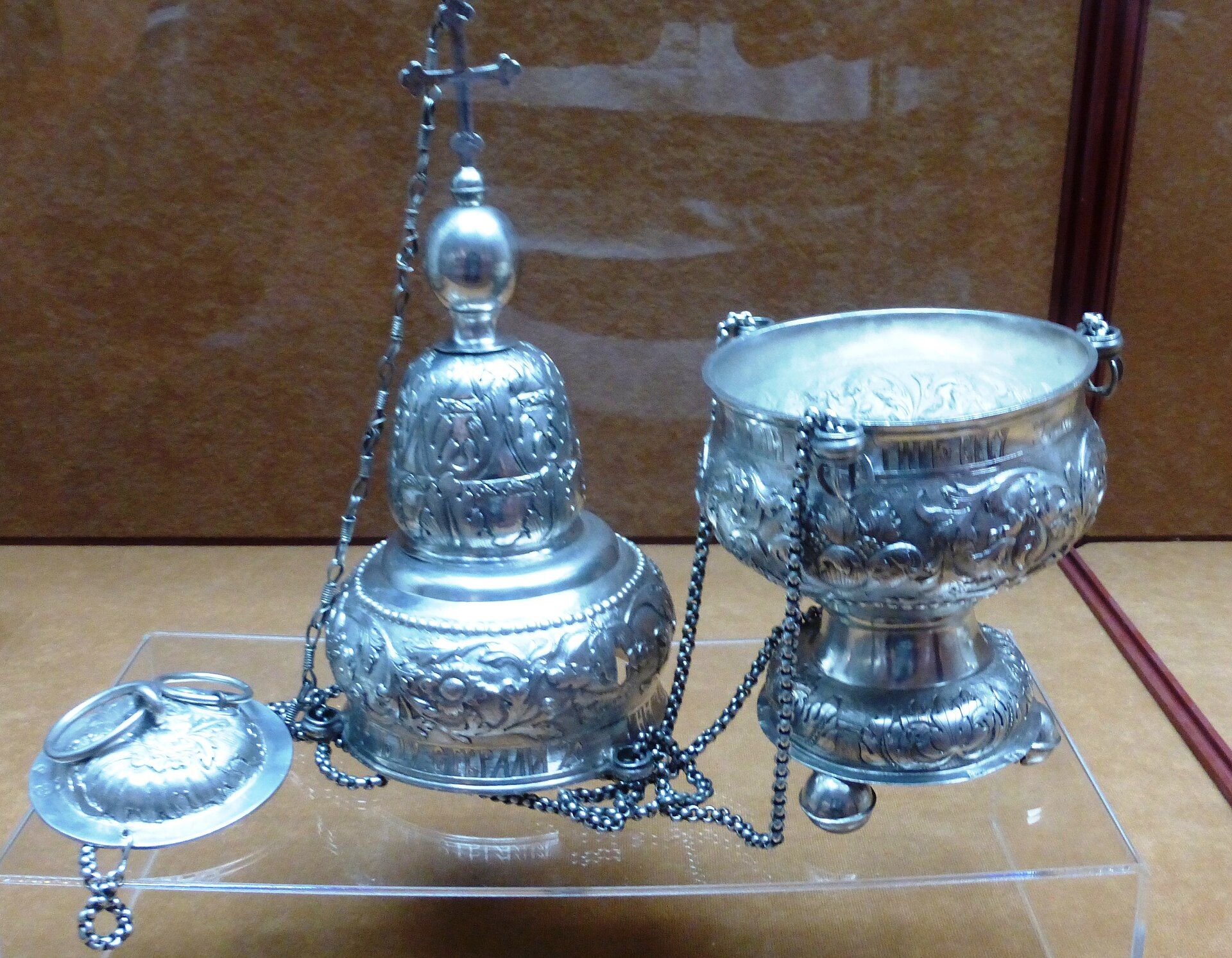 A historic silver Orthodox censer and liturgical vessel displayed together