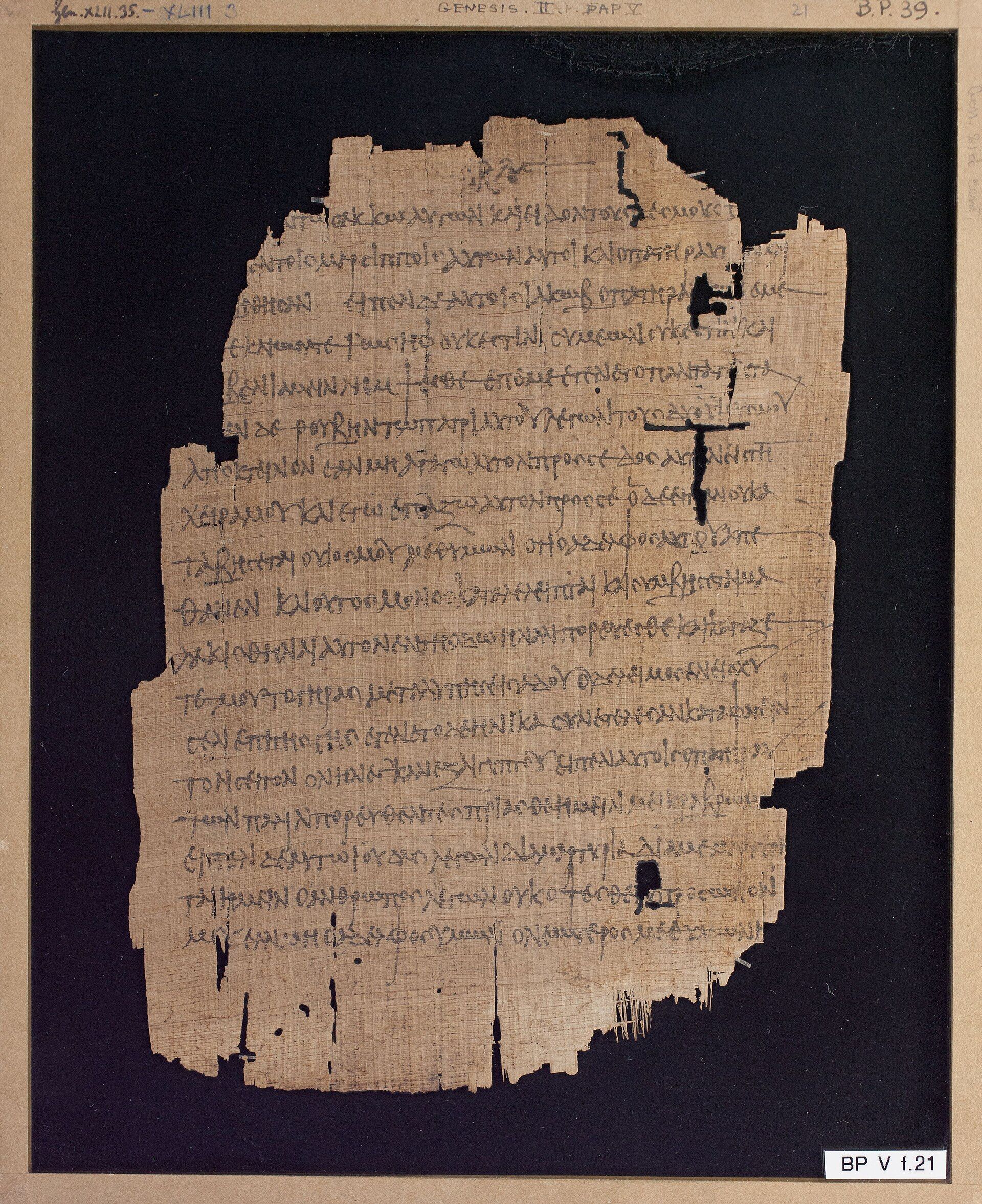 Ancient Greek Genesis fragments written in dark ink on weathered papyrus